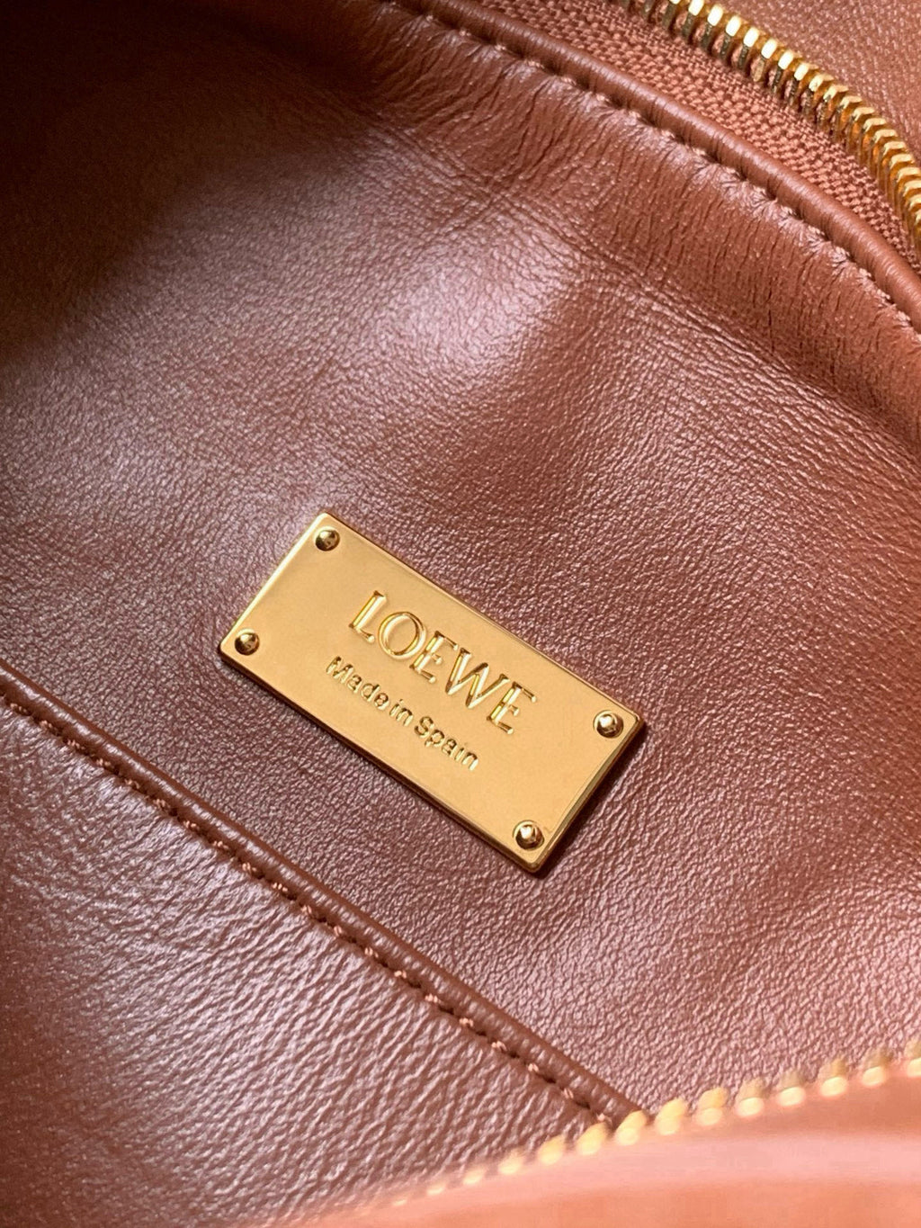 Loewe brown leather bag with gold metal logo plate and topstitched seam