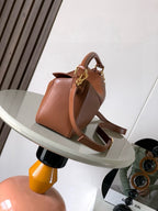 Loewe crossbody bag in tan-brown leather with adjustable strap and gold clasp