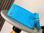 Blue leather crossbody bag with front flap and silver turn-lock hardware