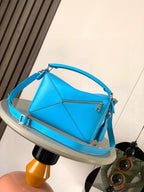 Loewe blue leather shoulder bag with top handle and crossbody strap, front view