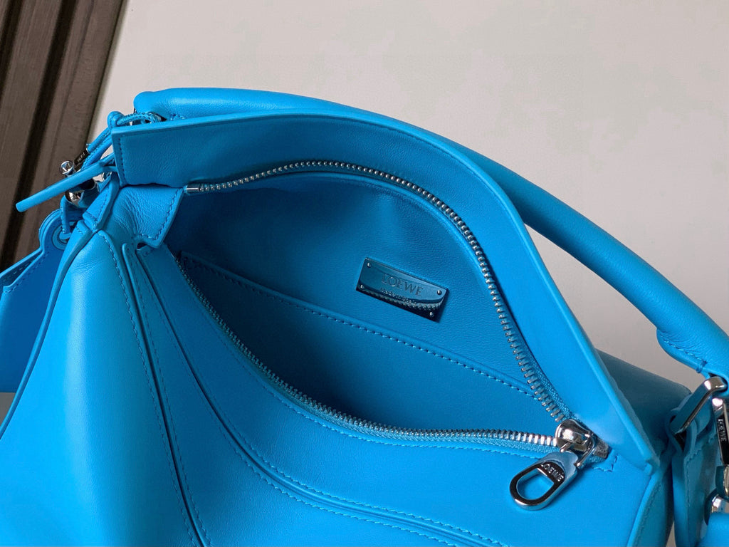 Loewe blue leather bag interior with zip closure and stitched lining