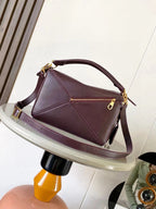 Loewe leather shoulder bag in dark burgundy with gold zipper and crossbody strap
