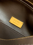 Brown leather bag with gold-tone Loewe nameplate and stitched edge