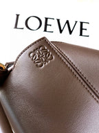 Brown leather bag with LOEWE embossed on front patch