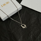 Gold-tone Dior necklace with D charm pendant on link chain