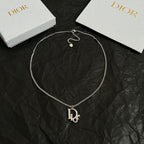 Silver-tone Dior necklace with D charm pendant and heart-shaped clasp