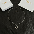 Silver-tone Dior necklace with D charm pendant and small pavé accents