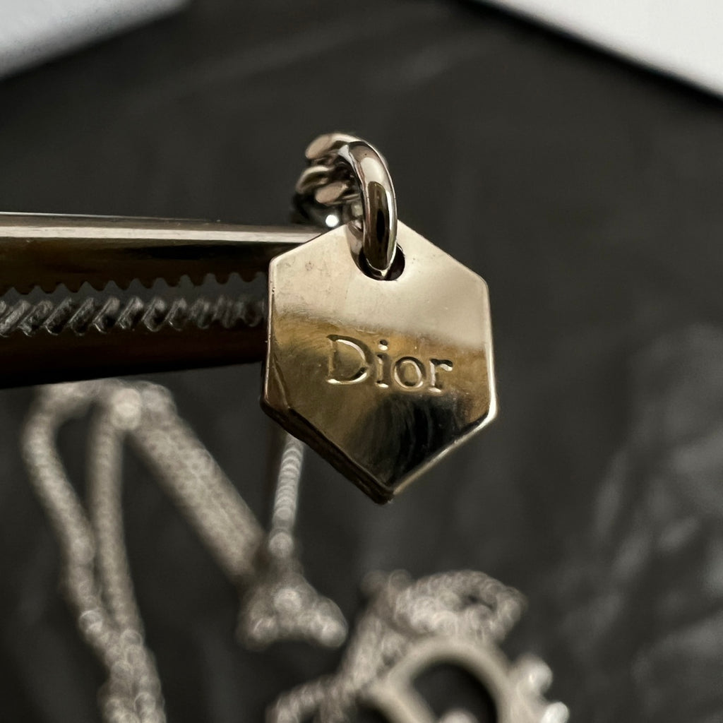 Gold-tone Dior engraved charm tag on ring, with chain connector
