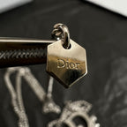 Gold-tone Dior engraved charm tag on ring, with chain connector