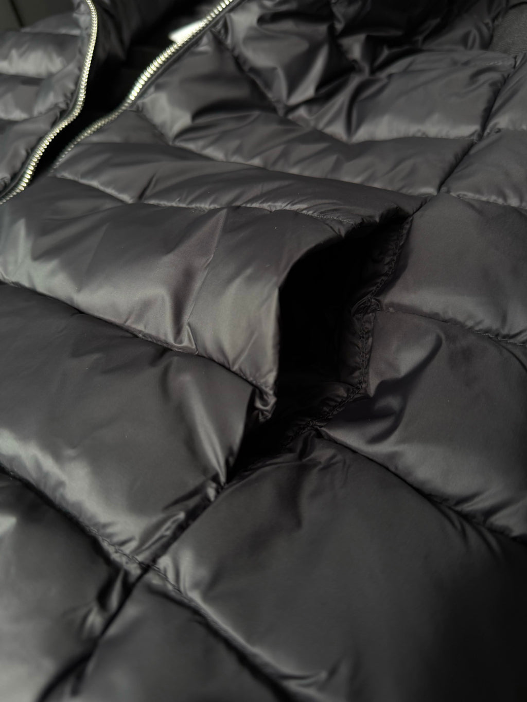 Quilted puffer fabric with stitched channels and seam detail