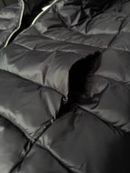 Quilted puffer fabric with stitched channels and seam detail