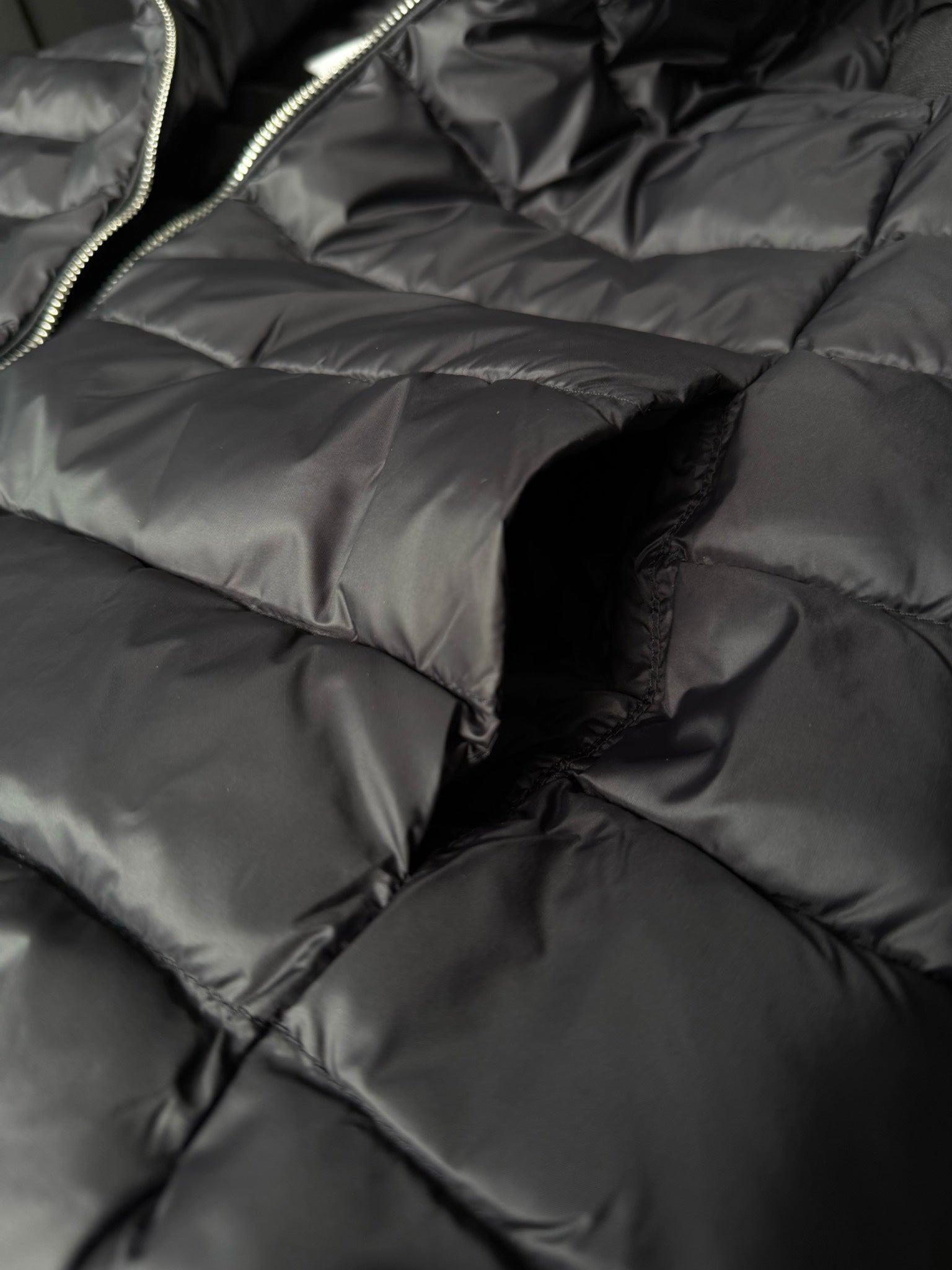 Quilted puffer fabric with stitched channels and seam detail