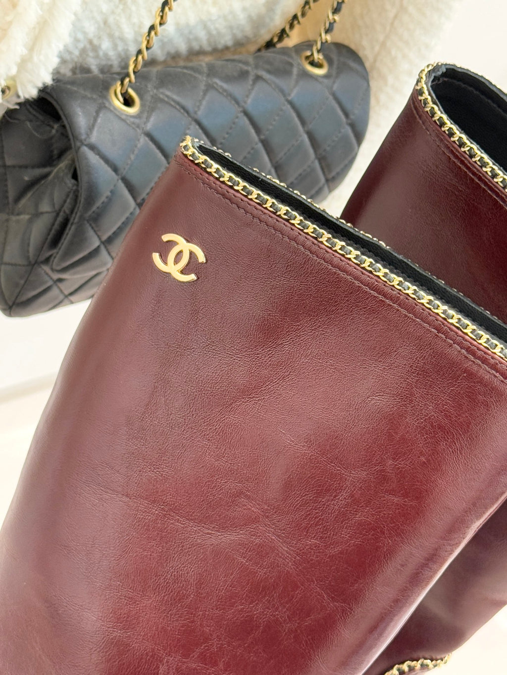 Burgundy boot upper with Chanel logo and gold chain-trim edging
