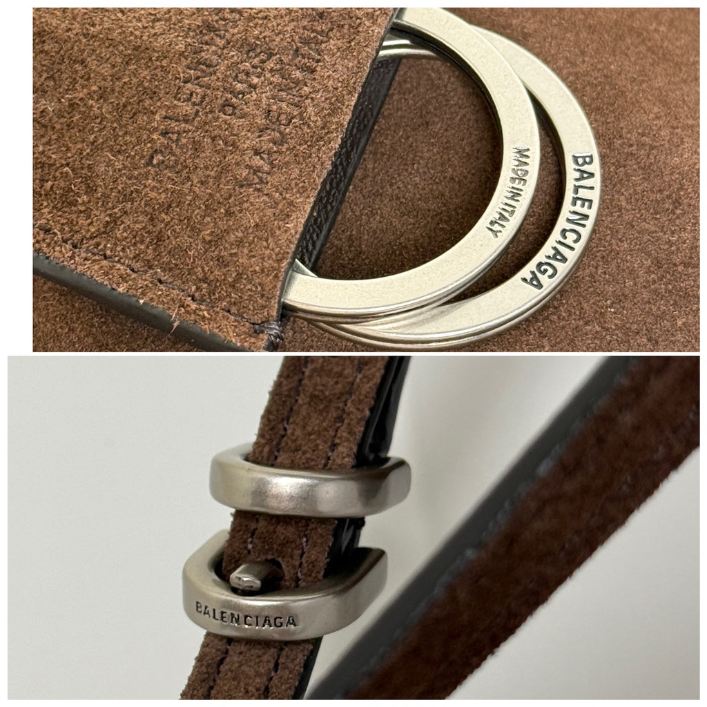 Balenciaga strap detail with silver ring hardware and printed webbing on brown suede.