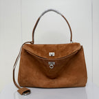 Tan suede top-handle handbag with flap clasp and metal trim, plus shoulder strap