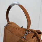 Balenciaga suede handle with metal rings and braided pull tab detail, tan brown