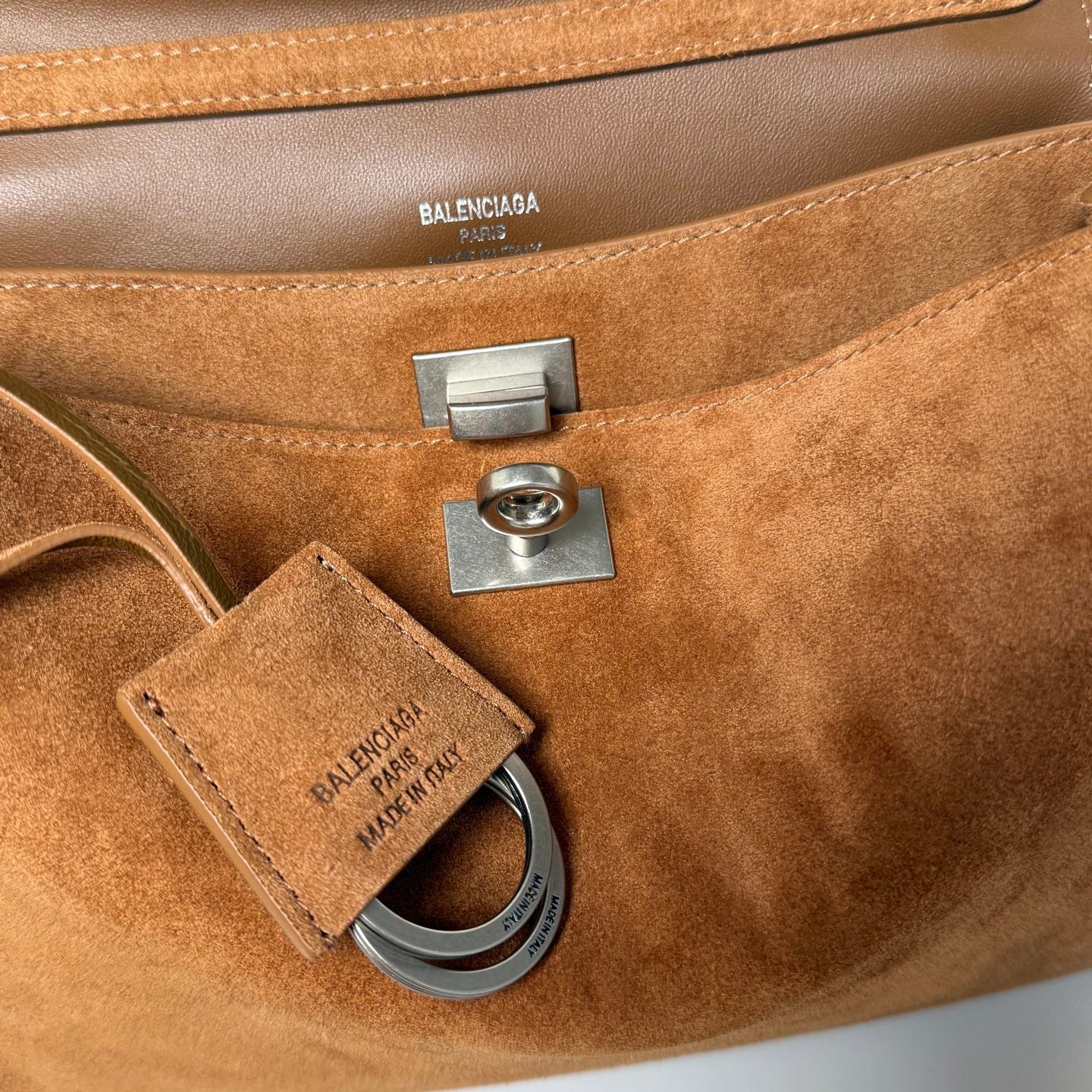 Balenciaga interior label and metal hardware on suede bag, BALENCIAGA PARIS MADE IN ITALY