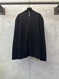 Black zip-up jacket with long sleeves and full front zipper