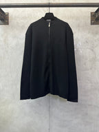 Black zip-up jacket with long sleeves and full front zipper