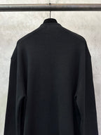 Black zip-up jacket, back view with high neckline