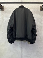 Black bomber jacket back view with ribbed hem and ribbed cuffs
