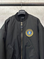 Black bomber jacket with zip placket and BALENCIAGA crest patch