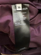 Inside size 38 fabric label on purple bomber jacket, made in Portugal