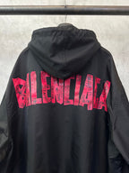 Black hooded jacket with red logo graphic on back and drawstring hem