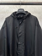 Black hooded jacket with front button placket and small chest pocket