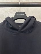 Black hoodie cowl neck with ribbed neckline, hanging Balenciaga tag