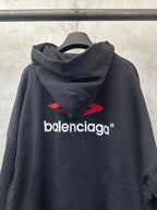 Black hoodie with red Balenciaga back logo, cowl hood and long sleeves