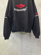 Black Balenciaga logo hoodie with red emblem, front pocket, long sleeves
