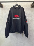 Black hoodie with Balenciaga logo and red emblem, front pocket, ribbed cuffs