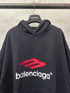 Black hoodie with red Balenciaga logo across chest, draped cowl hood
