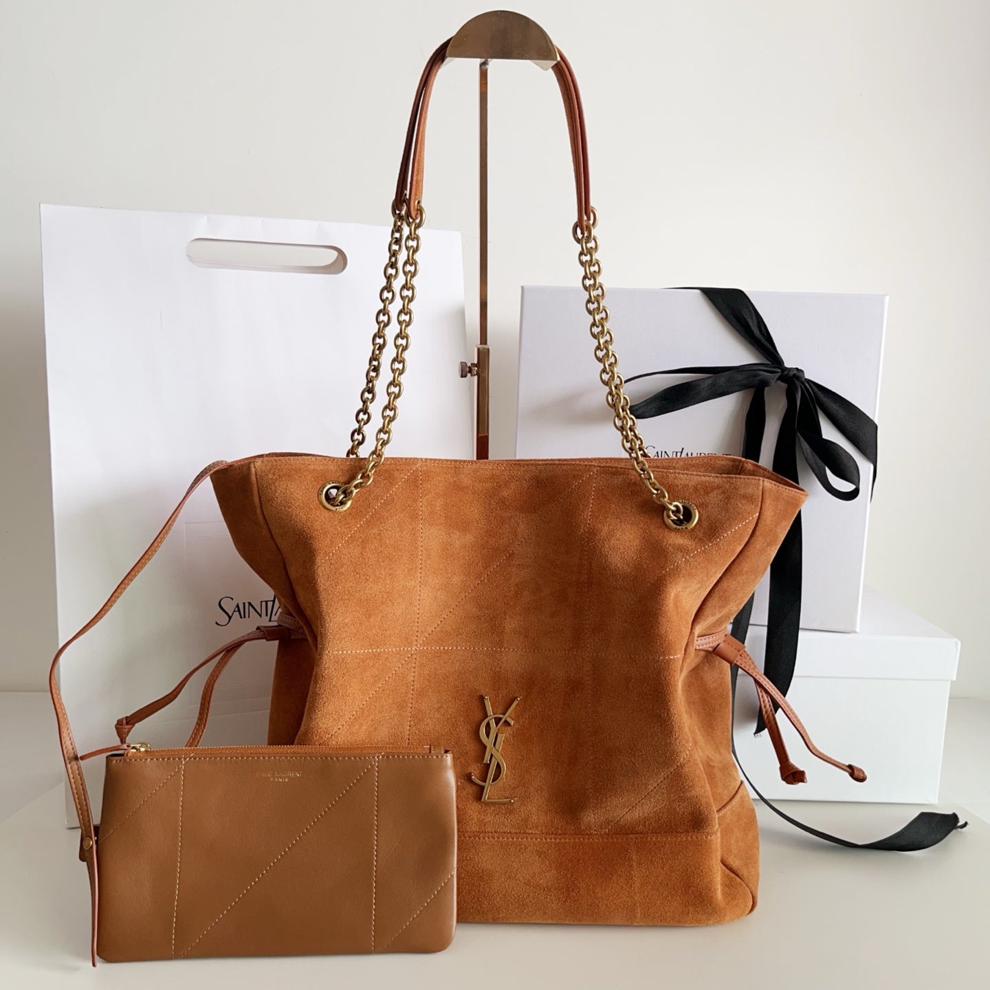 YSL chain-strap suede tote bag in tan with top handles and front YSL logo