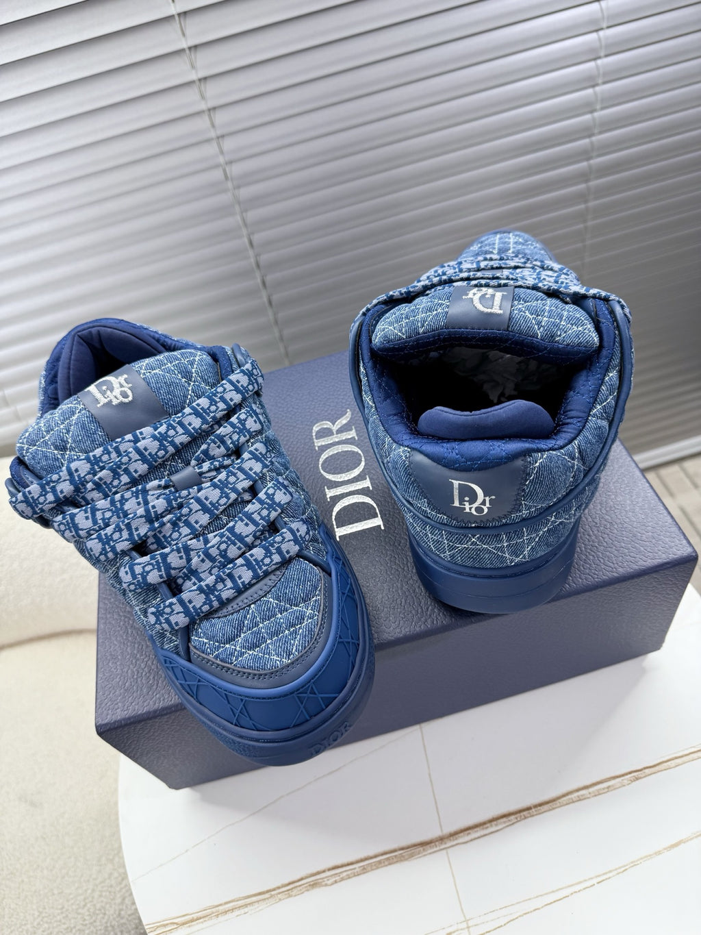Blue unisex Dior sneakers, padded collar interior with quilted logo pattern