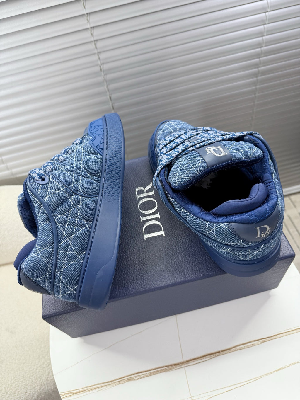 Blue unisex Dior sneakers, heel and side view with quilted logo print