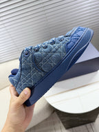 Blue unisex Dior sneakers, close-up toe and lace-up eyelets