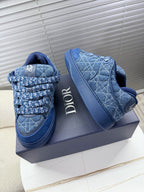 Blue unisex Dior sneakers, side view with quilted pattern and logo band