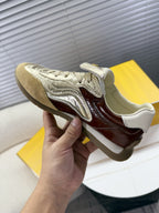 Fendi unisex luxury sneaker, metallic silver toe with brown leather side profile