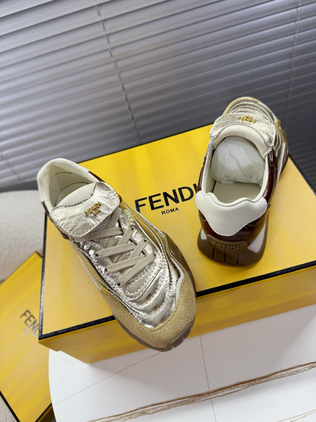 Fendi unisex luxury sneakers, metallic silver with cream collars and lace-up front