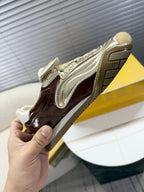 Fendi unisex luxury sneakers, heel and side view with metallic silver trim on brown
