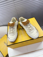 White leather low-top sneakers with brown suede heel tab and Fendi Roma patch
