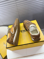 Brown lace-up low-top sneakers shown from front and back, with white side swoop