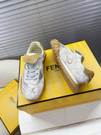 Light gray Fendi lace-up sneakers with tan collar lining and chunky sole