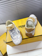 Light gray Fendi sneakers with tan interior lining and lace-up side detail