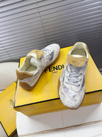 Light gray Fendi lace-up sneakers with tan heel tab and padded collar