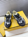 Fendi lace-up sneakers, black and white splatter, cream lining, low-profile sole.