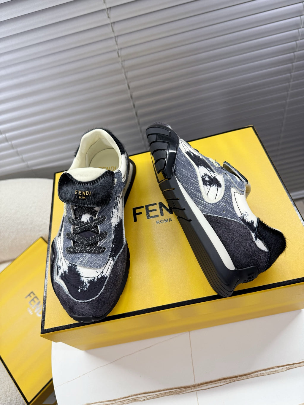 Fendi unisex sneakers, side view with dark denim, white speckles, chunky sole