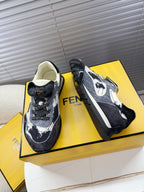 Fendi unisex sneakers, side view with dark denim, white speckles, chunky sole